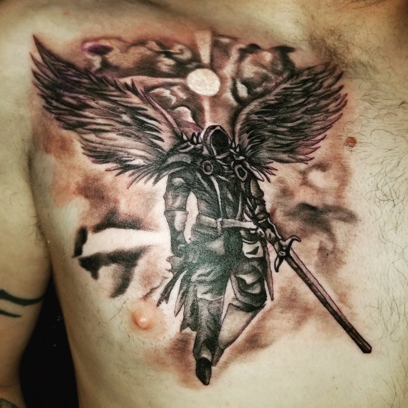 Black and grey angel and warrior chest tattoo