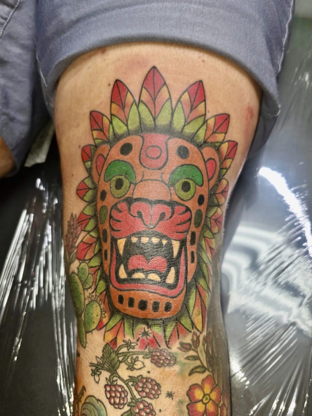 Colorful Aztec style mask tattoo