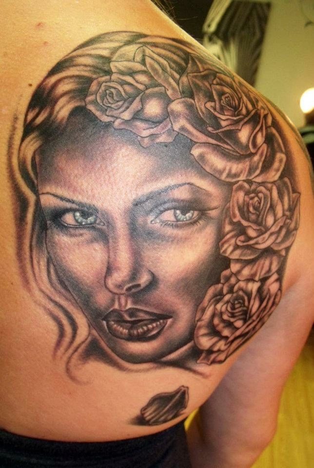 Color realism portrait tattoo of a woman